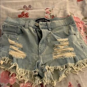 Distressed light denim shorts